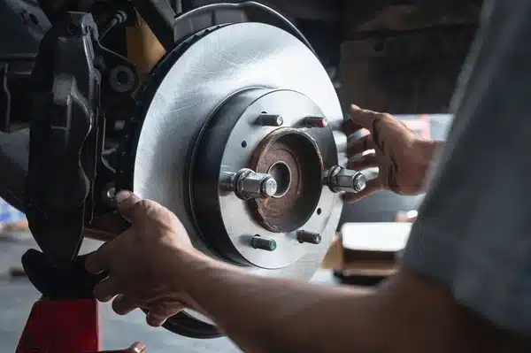 Brake and Suspension Specialists: Finding Reliable Mechanics in Southport auto mechanic installing car front 600nw 2224560469